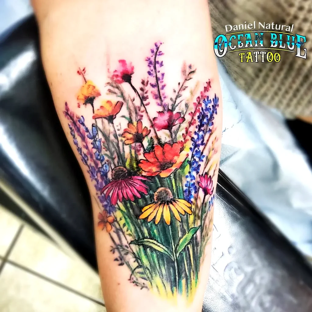 Tiny couple tattoo ideas with wildflower nature design 