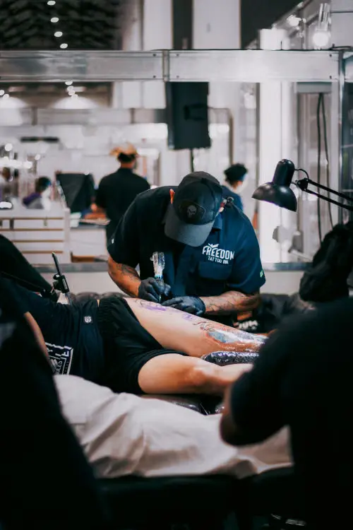 Tiny couple tattoo ideas tattoo artist working in studio