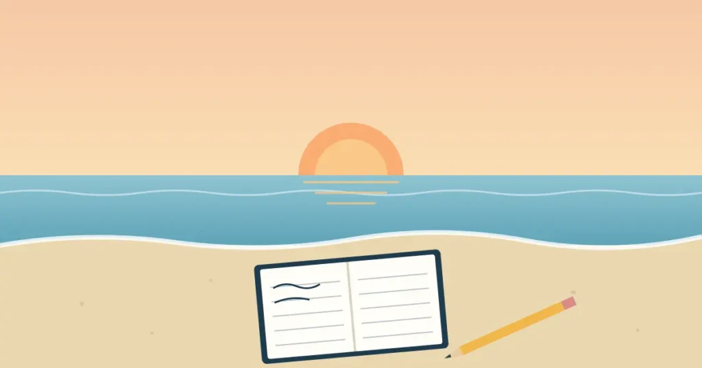 Beach writing notebook and pencil resting on sand at sunrise